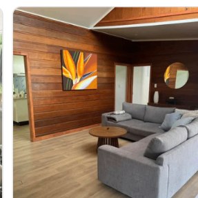 Living area with timber wall and artwork